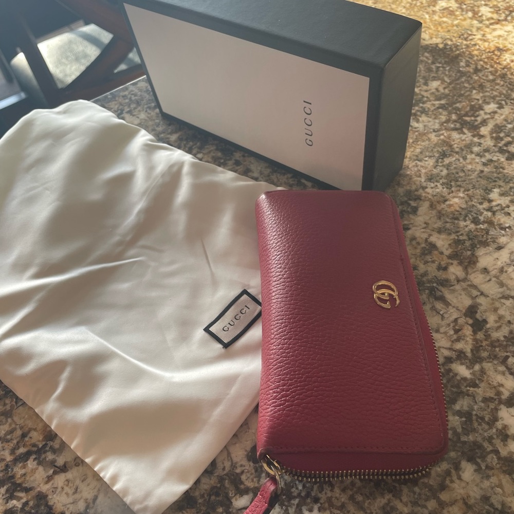 Red  authentic GUCCI wallet .  3 years old .